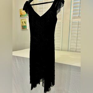 A lovely lightweight handkerchief beaded dress. A flattering fun dress.